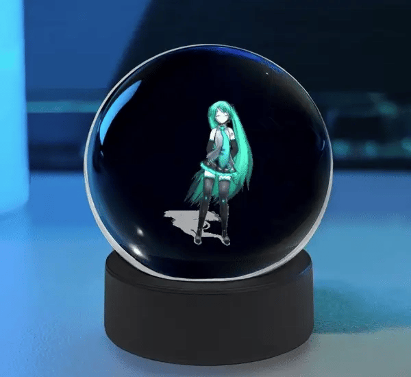 Cute Sphere Vision 3D hologram display ball with animated LED visual effects on a desktop