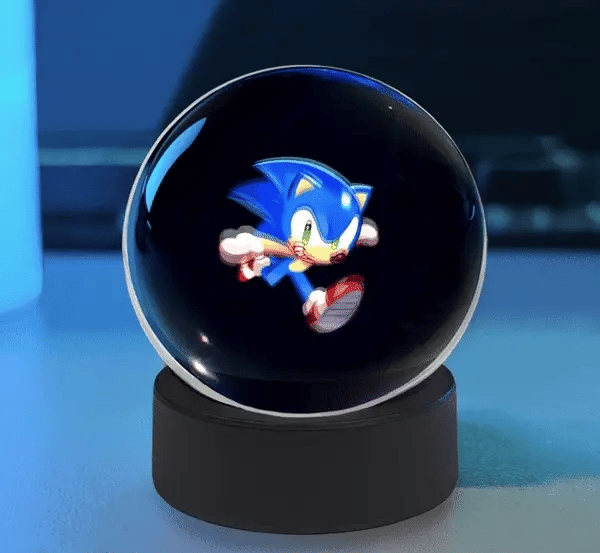 Cute Sphere Vision 3D hologram display ball with animated LED visual effects on a desktop